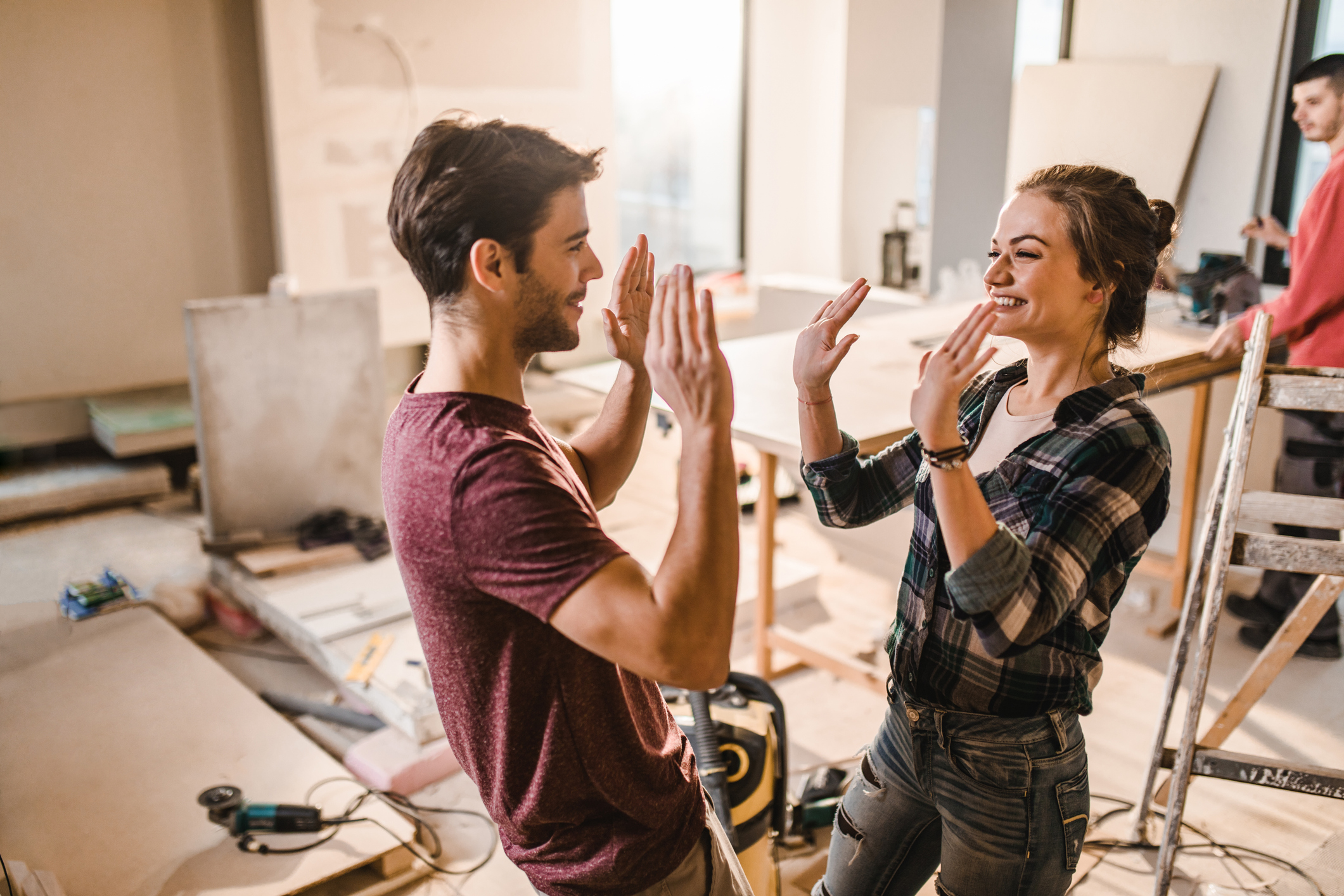 Couple enjoying successful home renovation project teamwork