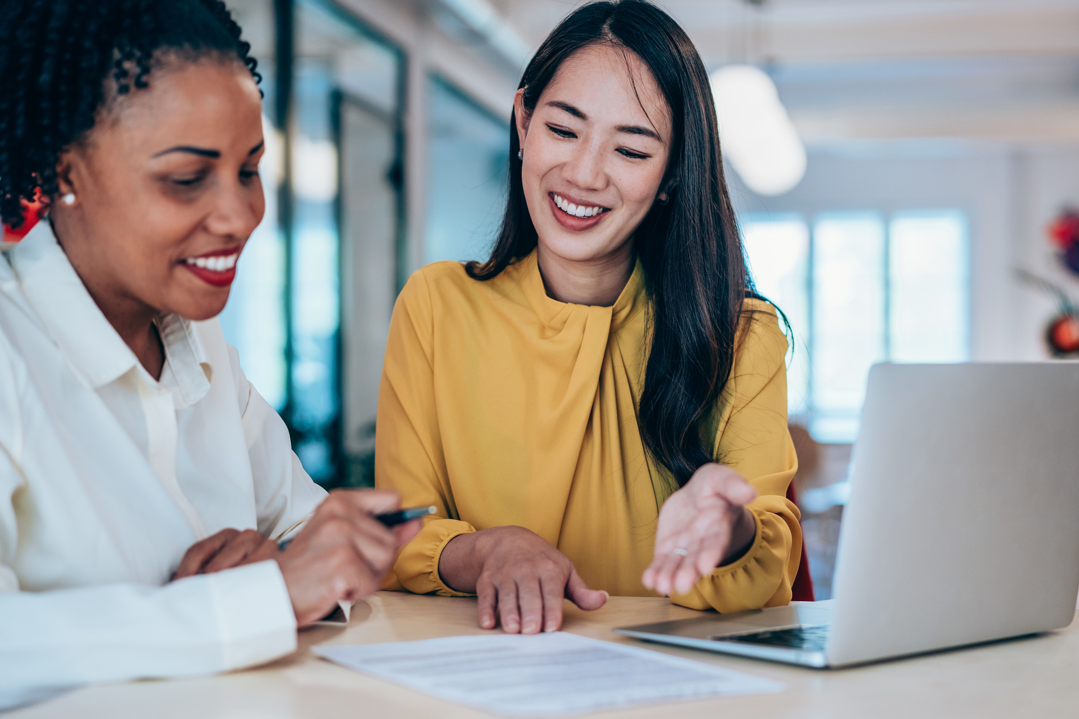 Two women collaborating in a modern office setting